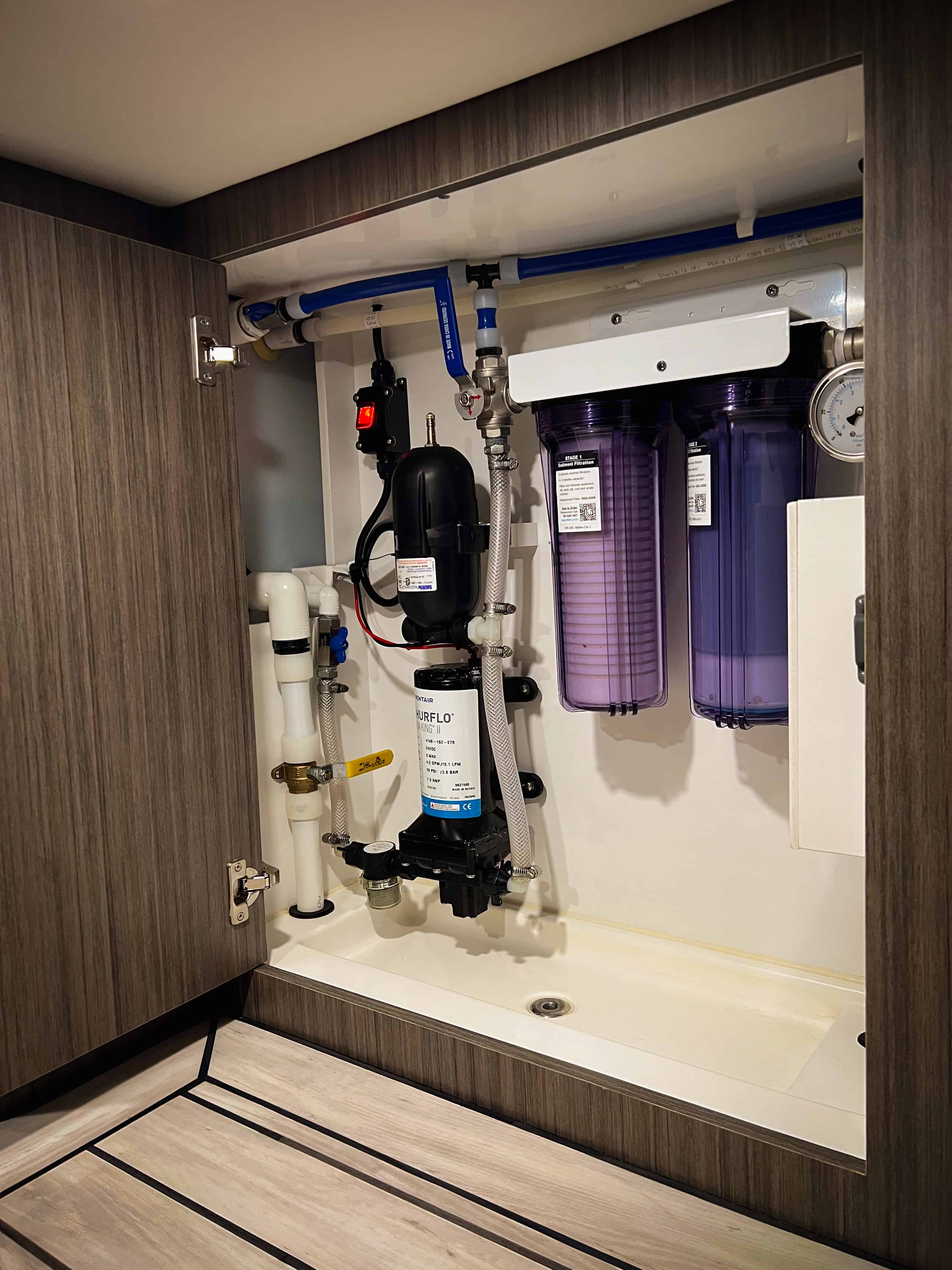 Water system cabinet with Shurflo pump, dual-stage filtration, and pressure gauge